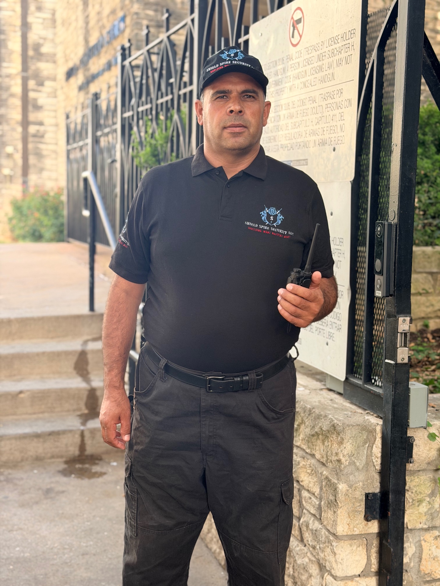 Officer maintaining situational awareness of the entrance approach between guest arrivals.