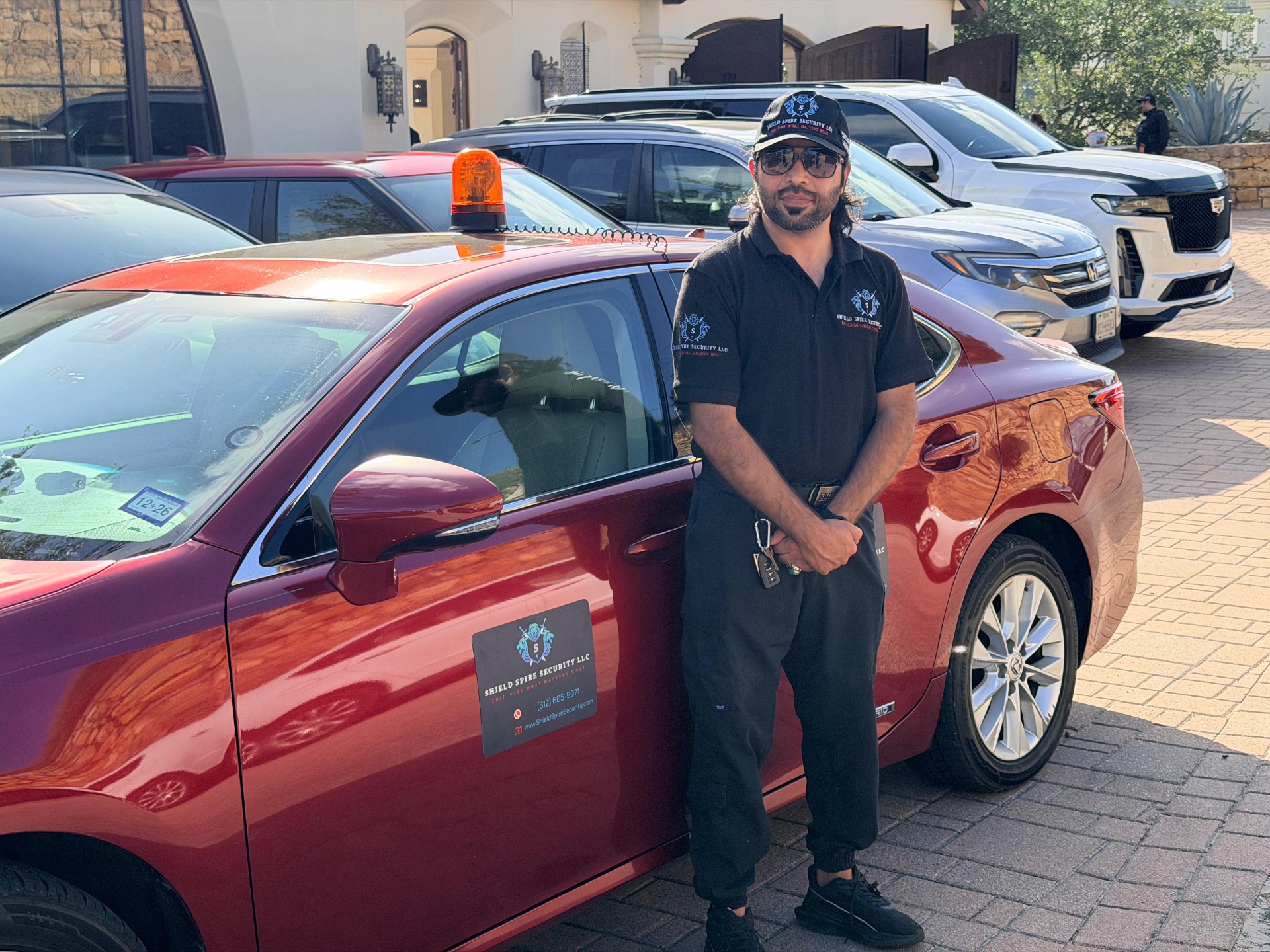 Level II Security Operations – officer maintaining situational awareness across the parking and arrival zone.