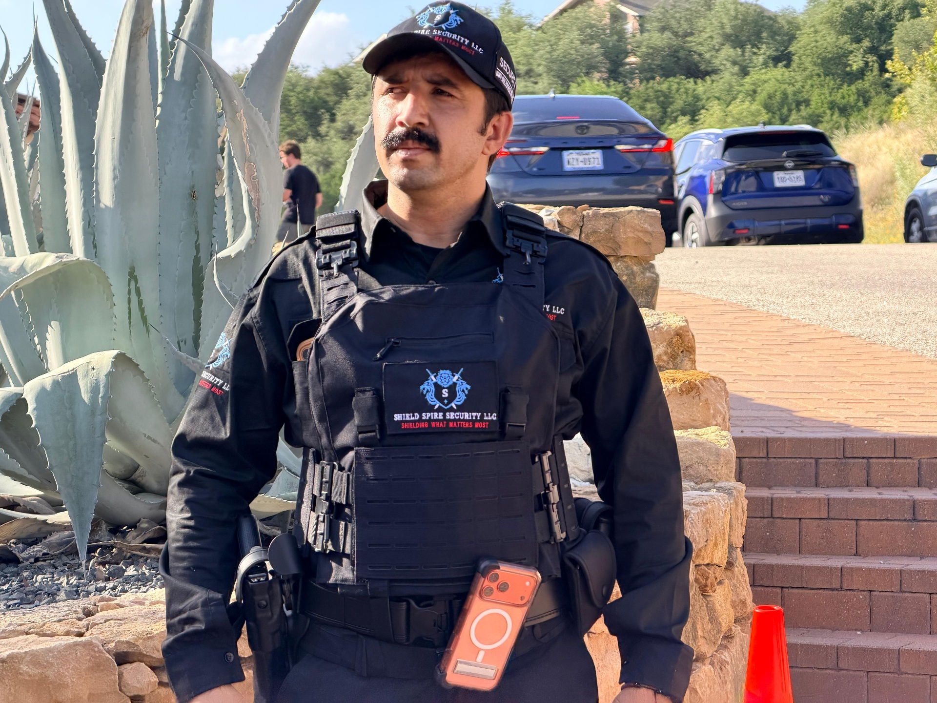 Level III Security Operations – armed officer maintaining a discreet protective presence on the estate grounds.