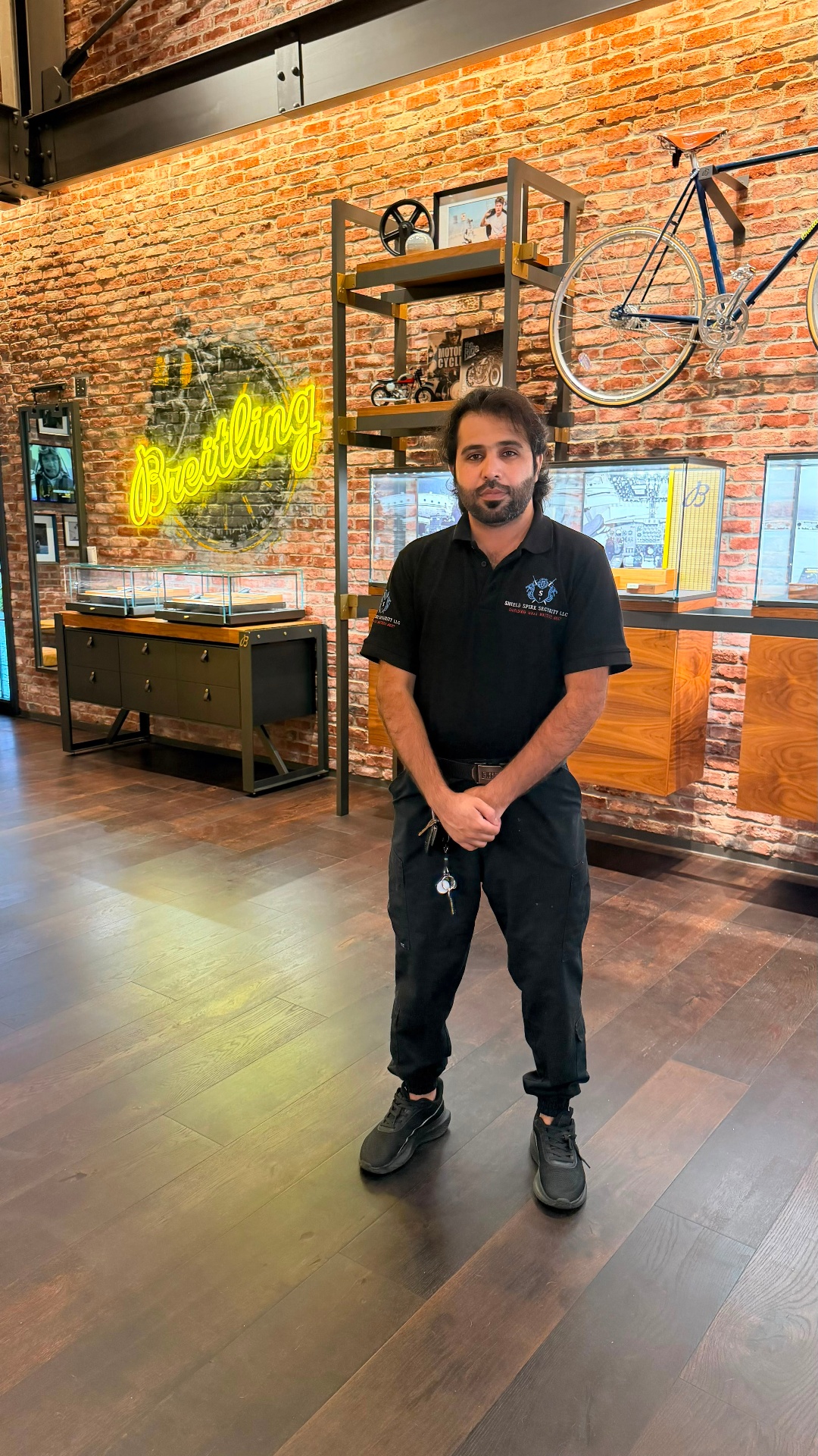 Shield Spire Security officer on post inside the luxury retail store during overnight renovation coverage.