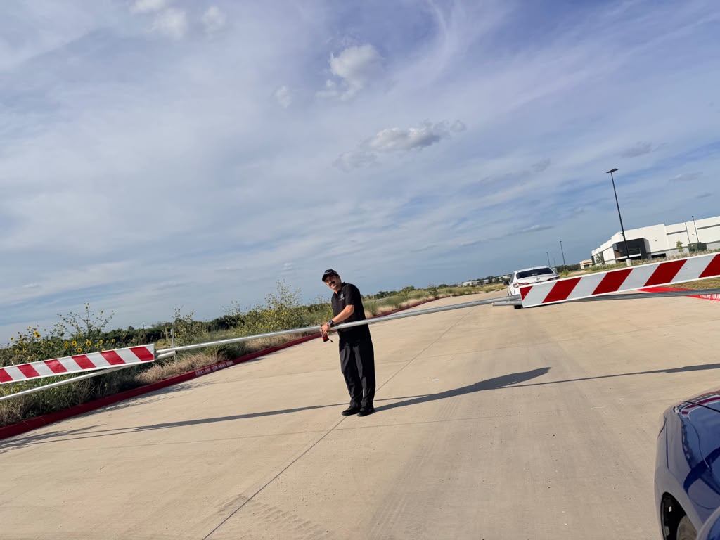 Access control at the facility entry gate — arm barrier operations and authorized vehicle verification during the deployment.