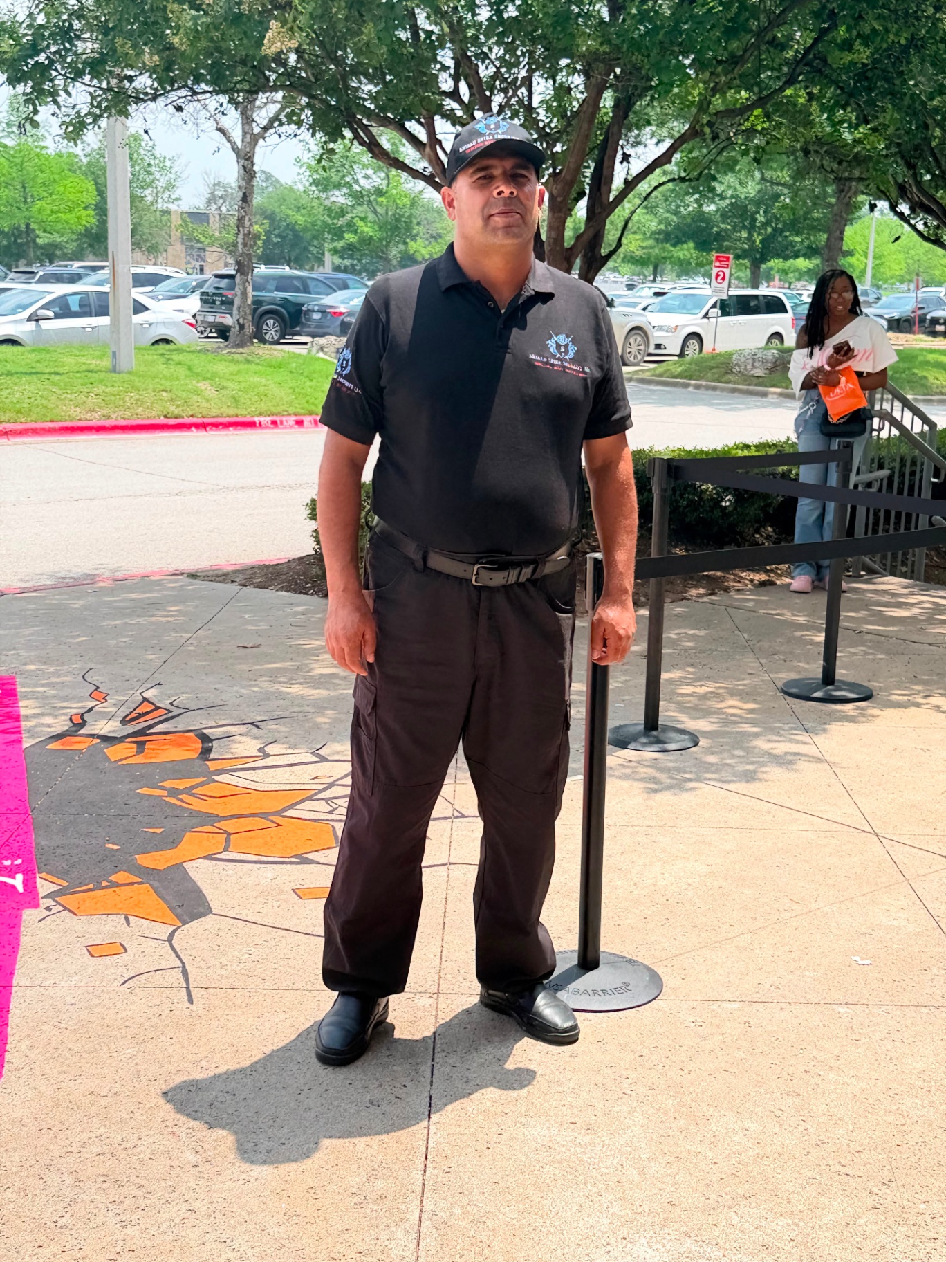 Officer positioned at the primary guest queue and entry point during celebrity appearance operations.